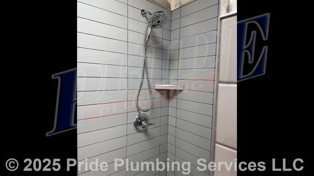 Pride Plumbing came out and performed the following work: 1) cut into and removed a small section of a shower's concrete flooring; dug down to the base of the shower drain's P-trap and drain line; removed the old shower drain and P-trap; rebuilt the shower drain and its P-trap with new PVC piping and fittings up to the floor height (connecting onto the existing drain line using a new Fernco coupling); and replaced the dirt and concrete we took out; and 2) replaced a leaking single-handle walk-in shower faucet valve with a new Delta single-handle model with chrome trim (shower head, faucet valve handle and cover, and drain cover) (this included cutting an access in the shower wall and replacing the valve along with short sections of its hot- and cold-water supply lines with new PEX piping and fittings).