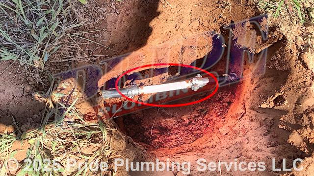 Pride Plumbing was called out for a water leak in the yard. We dug down and found a leak on a section of the black roll outside main water supply line. We cut out the faulty section of pipe and repaired it with new PEX piping and fittings. We also provided cost estimates to perform the following work: 1) replace a pressure reducing valve (PRV) at the water meter due to high water pressure in the home; 2) replace a 40-gallon electric Whirlpool E2F40LD045V lowboy water heater with a new 40-gallon electric lowboy model; 3) use a sewer machine to unclog a slow-draining kitchen sink drain; 4) replace a sillcock main water shutoff valve with a new ball water shutoff valve; and 5) replace a leaking outside hose bib spigot.