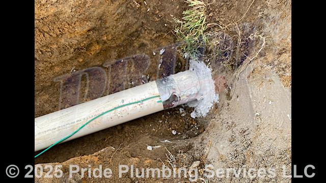 Pride Plumbing came out and performed the following work: 1) dug up an existing 2-inch PVC drain line going to a wet well; 2) installed new 4-inch PVC piping and tracer wire in the ditch along with two two-way cleanouts; 3) core-drilled the side of the catch basin and installed a tap for the new drain line; 4) connected the drain line to the tap and sealed around the tap; and 5) backfilled the ditch after the work was completed and checked for proper drainage and working order.