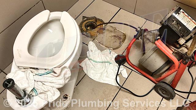 Pride Plumbing was called out for a clogged Mansfield commercial toilet. After removing the flush valve and pulling the toilet, we used a sewer machine down through the toilet's flange and cleared the blockage. Before replacing the toilet bowl's wax ring gasket and toilet bowl bolts and caps, and resetting the toilet, we inserted a camera into the drain line, and it did not reveal any additional issues.