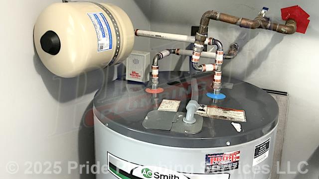 Hamlet, NC - Pride Plumbing came out and installed a new HydraPro HPTET2 2-gallon thermal expansion tank at a 40-gallon electric A.O. Smith lowboy water heater using new PEX piping and fittings. We also provided cost estimates to 1) replace the water heater with a new 40-gallon electric lowboy model; and 2) replace a faulty pressure reducing valve (PRV) at the water meter (attaching it to the existing black roll outside main water supply line with new PEX piping and fittings and adding a ball water shutoff valve). Hamlet, NC - Pride Plumbing came out and installed a new HydraPro HPTET2 2-gallon thermal expansion tank at a 40-gallon electric A.O. Smith lowboy water heater using new PEX piping and fittings. We also provided cost estimates to 1) replace the water heater with a new 40-gallon electric lowboy model; and 2) replace a faulty pressure reducing valve (PRV) at the water meter (attaching it to the existing black roll outside main water supply line with new PEX piping and fittings and adding a ball water shutoff valve).