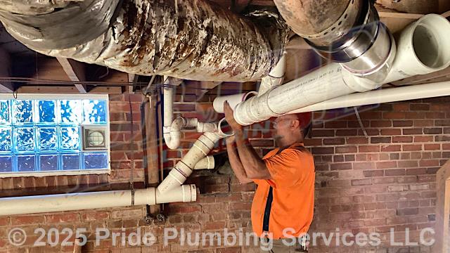 Pride Plumbing came out and repiped and replaced the cast iron drain lines under the house in the basement, going to a) the fixtures in the kitchen (sink and dishwasher) and one bathroom (sink, toilet, and bathtub/shower) - replacing the toilet bowl's flange and wax seal, the P-traps underneath all the sinks, and the bathtub/shower's waste and overflow; and b) the washing machine - installing new PVC piping, fittings and supports under the house and up through the flooring for each fixture and air admittance valves inside the home where needed.