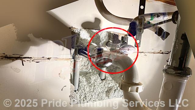 Pride Plumbing was called out for a water leak underneath a bathroom sink. Our inspection found that the sink's hot and cold water supply lines were leaking at their nipples and supply stops. After cutting an access in the bathroom sink wall, we replaced the nipples, and supply stops, and tested for leaks with no further issues. We also provided cost estimates to replace bathroom sink faucet with either a new customer-supplied model or a Pride Plumbing supplied Delta, Olympia, or Peerless model (this would include removing the old faucet, mounting the new faucet, and replacing the above floor braided stainless steel water supply lines underneath the sink).
