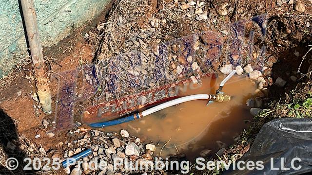 Pride Plumbing was called out for a water leak in the yard underneath a yard hydrant. We dug down and found a leak on a section of the yard hydrant's copper water supply line. After cutting off the water, we cut out the faulty section of pipe, repaired it with new PEX and copper piping and ProPress fittings, added a ball water shutoff valve, turned the water back on, flushed debris out of the water line, and tested for leaks with no further issues. We also provided a cost estimate to trench a ditch from the water meter to the yard hydrant and replace its water supply line with new PVC piping and fittings.