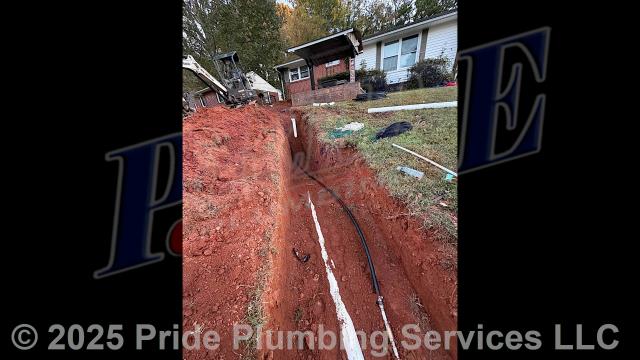 Pride Plumbing came out and performed the following work: 1) trenched a ditch from the house to the town sewer tap to expose and remove the outside main sewer septic drain line; 2) installed a new 4-inch PVC sewer drain line (connecting it to the main drain line under the home) along with proper cleanouts and fittings per code; 3) installed tracer wire in the ditch along with the new sewer drain line; and 4) backfilled, tamped, and spread grass seed and straw after the work had been inspected and approved by Forsyth County's Inspection Department.