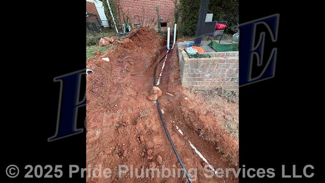 Pride Plumbing came out and performed the following work: 1) trenched a ditch from the house to the town sewer tap to expose and remove the outside main sewer septic drain line; 2) installed a new 4-inch PVC sewer drain line (connecting it to the main drain line under the home) along with proper cleanouts and fittings per code; 3) installed tracer wire in the ditch along with the new sewer drain line; and 4) backfilled, tamped, and spread grass seed and straw after the work had been inspected and approved by Forsyth County's Inspection Department.