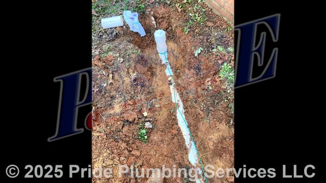 Pride Plumbing came out and 1) used an excavator to trench a ditch from the house to the town sewer tap to expose and remove the outside main sewer septic drain line; 2) installed a new 4-inch PVC sewer drain line (connecting it to the main drain line under the home) along with proper cleanouts and fittings per code; 3) installed tracer wire in the ditch along with the new sewer drain line; and 4) backfilled, tamped, and spread grass seed and straw after the work was inspected and approved by Montgomery County's Inspection Department.