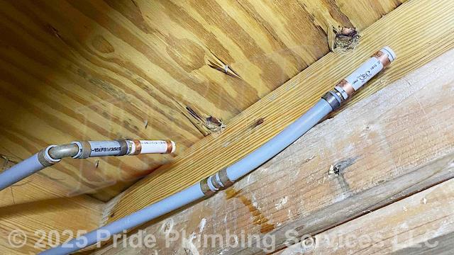 Pride Plumbing was called out for a water leak in the wall behind a bathroom sink vanity. We removed the bathroom sink vanity and opened the wall to find a hole made by a mouse on the sink's cold-side water supply line. We cut out the damaged section of pipe and capped both the hot and cold water supply lines. We also provided a cost estimate to repipe and replace the water supply lines under the house in the crawlspace, going to the fixtures in the kitchen (sink faucet, dishwasher, and ice maker), one bathroom (sink, toilet, and bathtub/shower), the washing machine (installing a new plastic washer box and hot and cold hose bibs or boiler drains), and the water heater, with new PEX piping and fittings (installing new 1/4 turn water shut-off valves on each fixture inside the building along with new above-floor stainless steel braided water supply lines).