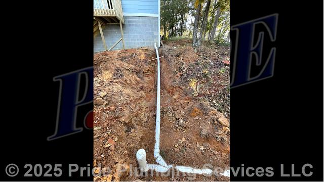 Pride Plumbing came out and 1) used an excavator to trench a ditch from the house to the town sewer tap to expose and remove the outside main sewer septic drain line; 2) installed a new 4-inch PVC sewer drain line (connecting it to the main drain line under the home) along with proper cleanouts and fittings per code; 3) installed tracer wire in the ditch along with the new sewer drain line; and 4) backfilled, tamped, and spread grass seed and straw after the work was inspected and approved by Montgomery County's Inspection Department.