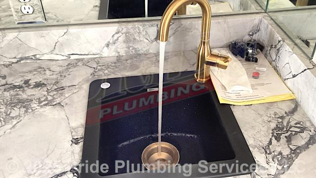 Pride Plumbing came out to remove a Blanco single-basin kitchen sink and install a customer-supplied kitchen sink faucet and basket strainer. First, we removed the sink basin. That was followed by us installing the faucet and attaching the basket strainer. Next, we reset the sink and remounted it. Then we reinstalled the P-trap, drain assembly, and braided stainless-steel water supply lines to the hot and cold water stops and faucet. Finally, we tested for leaks and proper operation with no issues.