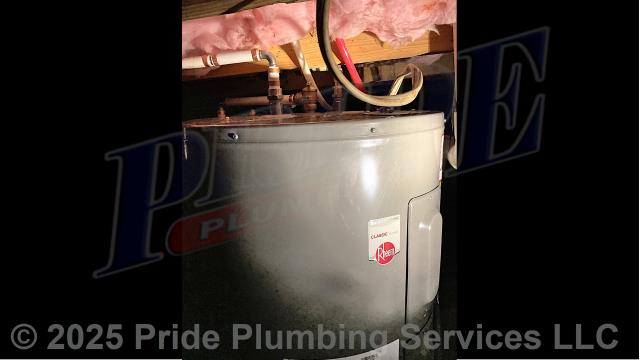 Pride Plumbing came out and replaced a leaking 38-gallon electric lowboy water heater with a new 38-gallon electric Rheem PROE38-S2-RH95-B lowboy model. First, after disconnecting its electrical connections and inlet and outlet water lines, we removed and disposed of the old water heater. Then we installed the new water heater, ball water shut-off valves, PEX and stainless-steel water supply lines to the water heater connectors, a brass drain valve, and wired up the electrical connections to the new water heater (adding a Romex connector). Finally, we bled the air out of the water lines, ensured that the unit’s temperature and pressure (T&P) relief valve was properly vented, and set the unit to its appropriate operating temperature.