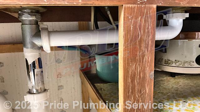 Pride Plumbing was called out for a water leak underneath a kitchen sink. Our inspection found that a metal waste arm trap adapter had deteriorated. We replaced it with a new PVC waste arm trap adapter and tested for leaks with no further issues.