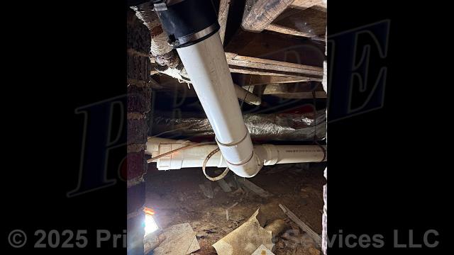 Pride Plumbing came out and, after cutting an access hole in the wall, replaced a leaking cast iron drain line through the floor to under the house in the crawlspace, and to where it tied into the main sewer drain stack, with new PVC piping and fittings, connecting onto the remaining existing cast iron piping with new Fernco couplings.