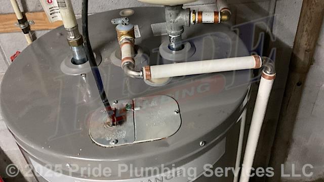 Pride Plumbing was called out for a water leak at a 40-gallon electric Rheem XE40M06ST45U1 water heater. We checked the water heater and found that its temperature and relief valve (T&P) had popped. Then we checked the water pressure in the home, and it was at 130 PSI. We went outside and installed a new Watts LFN45BM1-DU-PEXXPEX pressure reducing valve (PRV) at the water meter, along with a new ball water shutoff valve and short new sections of PEX piping (connecting onto the existing black roll piping with new hose clamps). We replaced the water heater’s T&P valve as well. We retested the home's water pressure after installation, and it was acceptable. We also provided cost estimates to replace the water line from the water meter to the house and to replace the water heater.