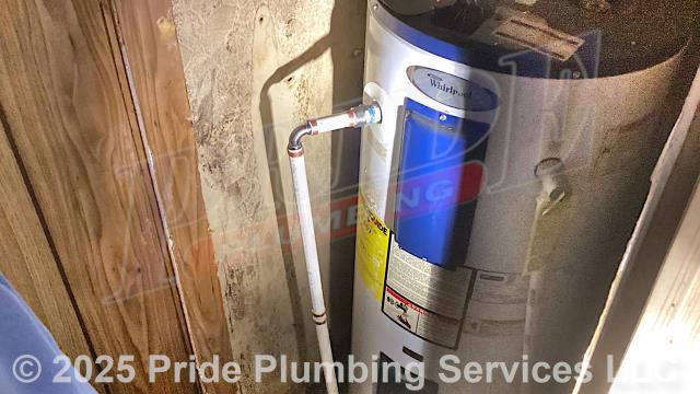 Pride Plumbing was called out for a water leak at a 30-gallon electric Whirlpool MHE2F30HS035V water heater. We found a leak on a copper water supply line. After shutting off the water, we cut out the leaking section of pipe and repaired it with new PEX piping and fittings. We then cut the water back on, drained out any debris at an outside hose bib spigot, and tested for leaks with no further issues. We also provided a cost estimate to replace the water heater with a new 40-gallon electric model. This would include removing and disposing of the old water heater; installing the new water heater, ball water shut-off valves, PEX and stainless steel water supply lines to the water heater's water connections, a brass drain valve, connecting the unit’s electrical connections (adding a Romex connector), bleeding the air out of the water lines, ensuring that the unit is properly vented, and setting it to its appropriate operating temperature.