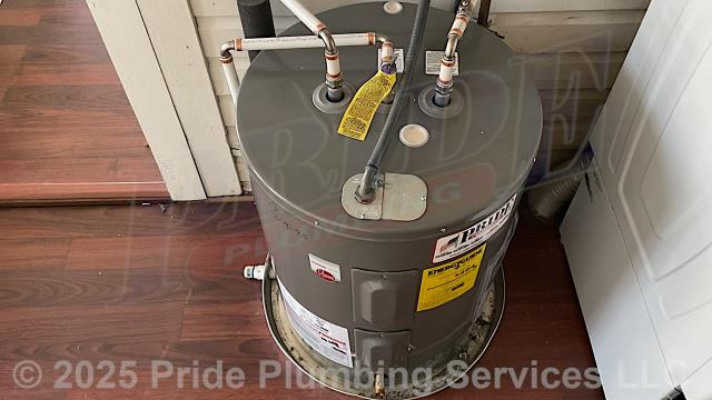 Pride Plumbing came out and replaced a leaking 38-gallon electric Reliance 606 lowboy water heater with a new 38-gallon electric Rheem PROE38-S2-RH95-B lowboy model. First, after disconnecting its electrical connections and inlet and outlet water lines, we removed and disposed of the old water heater. Then we installed the new water heater, ball water shut-off valves, PEX and stainless-steel water supply lines to the water heater connectors, a brass drain valve, and wired up the electrical connections to the new water heater (adding a Romex connector). Finally, we bled the air out of the water lines, ensured that the unit’s temperature and pressure (T&P) relief valve was properly vented, and set the unit to its appropriate operating temperature.