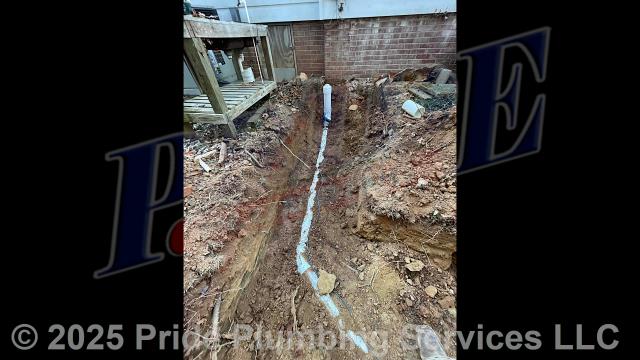 Pride Plumbing came out and 1) used an excavator to trench a ditch from the house to the town sewer tap to expose and remove the outside main sewer septic drain line; 2) installed a new 4-inch PVC sewer drain line (connecting it to the main drain line under the home) along with proper cleanouts and fittings per code; 3) installed tracer wire in the ditch along with the new sewer drain line; and 4) backfilled, tamped, and spread grass seed and straw after the work was inspected and approved by Randolph County's Inspection Department.