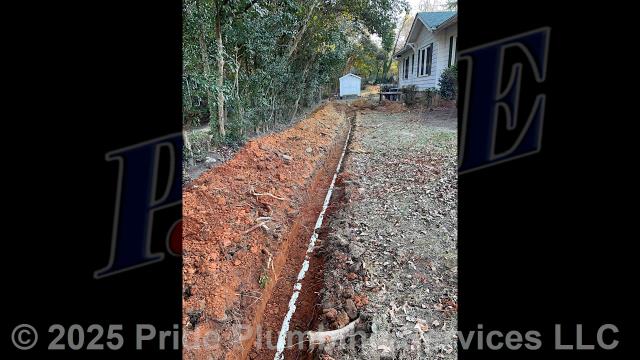 Pride Plumbing came out and 1) used an excavator to trench a ditch from the house to the town sewer tap to expose and remove the outside main sewer septic drain line; 2) installed a new 4-inch PVC sewer drain line (connecting it to the main drain line under the home) along with proper cleanouts and fittings per code; 3) installed tracer wire in the ditch along with the new sewer drain line; and 4) backfilled, tamped, and spread grass seed and straw after the work was inspected and approved by Randolph County's Inspection Department.