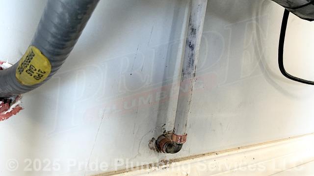 Pride Plumbing was called out for a water leak at a Navien tankless water heater located in a garage. We found a leak on a PEX inlet water supply line. We cut out the leaking section of pipe and repaired it with new PEX piping and fittings.