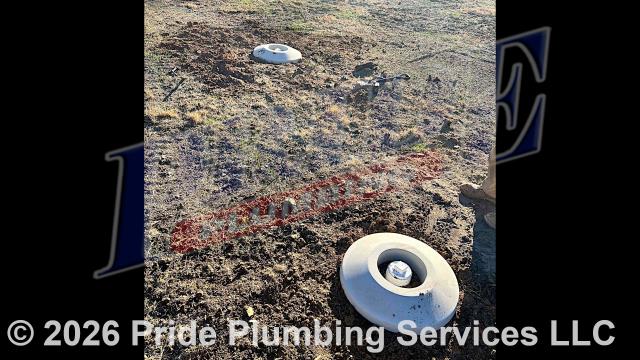 Pride Plumbing came out and dug down in the yard to expose and access the outside main sewer septic drain line, cut into the line, installed two new two-way PVC cleanouts with caps (connecting them to the existing outside main sewer septic drain line with new PVC fittings and Fernco couplings), covered the area we dug up after installation, and added concrete collars around the cleanout caps.