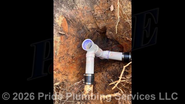 Pride Plumbing came out and performed the following work: 1) used an excavator to dig down in the yard to expose a defective section of the outside main sewer septic drain line that had been penetrated by roots; 2) replaced that section of sewer line with new PVC piping and fittings (installing two new 4-inch Santee's) along with installing a new PVC two-way clean out and connecting onto the existing PVC drain pipe with two new Fernco couplings; 3) tested the new piping for leaks and proper drainage; and 4) backfilled, tamped, and spread grass seed and straw after the work had been completed.