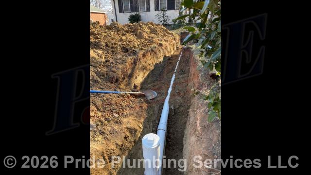 Pride Plumbing came out and 1) used an excavator to trench a ditch from the house to the town sewer tap to expose and remove the outside main sewer septic drain line; 2) installed a new 4-inch PVC sewer drain line (connecting it to the town's sewer tap at the edge of the property and the main drain line underneath the home) along with proper cleanouts and fittings per code; 3) installed tracer wire in the ditch along with the new sewer drain line; and 4) backfilled, tamped, and spread grass seed and straw after the work was inspected and approved by Randolph County's Inspection Department.