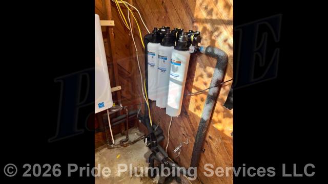 Pride Plumbing came out and 1) demoed a kitchen sink, dishwasher, bathroom sink, toilet, and shower; 2) in the kitchen, installed a kitchen sink and faucet, dishwasher, refrigerator ice maker, and gas supply line to a gas stove; 3) in the bathroom, installed a sink and faucet, toilet, and tile shower (including the shower valve, valve handle(s), showerhead, and drain); 4) made all the water and drain connections underneath the home; and 5) installed an Honest Water Filter Company Silver Plus whole-house water filtration system (this includes installing the unit's manifold with a Defender pre-filter and two 5-micron filters along with the bypass system, rinse valve and pressure gauge; mounting the water filter base, running and connecting new PEX piping inlet and outlet water supply lines to the base and the existing water lines underneath the home and adding ball water shutoff valves; installing the water filter housing, and testing for leaks and proper operation.