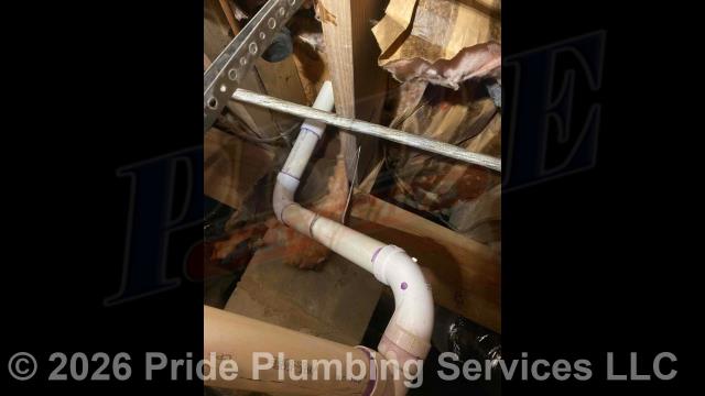 Pride Plumbing came out and replaced the cast iron drain lines for a double bathroom sink vanity through the floor and tied into the PVC drain line underneath the home (tying onto the existing cast iron piping exiting the home's foundation with a new Fernco coupling), adding an air admittance valve underneath the bathroom sink cabinet, and replacing a bathtub/shower drain with a new Watco drain.