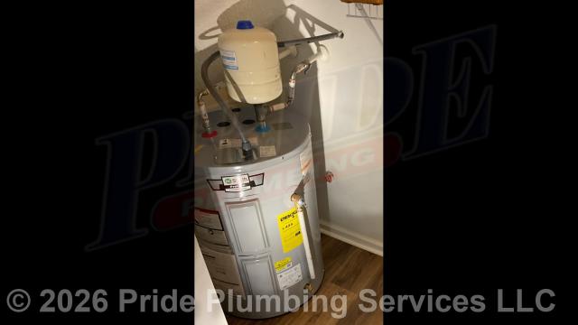 Pride Plumbing came out and replaced a leaking 38-gallon electric Rheem 82SV40-2 lowboy water heater with a new 38-gallon electric A.O. Smith ENLB-40 110 lowboy model. This included removing and disposing of the old water heater; installing water heater pads, the new water heater, thermal expansion tank, ball water shut-off valves, PEX and stainless steel water supply lines to the water heater connectors, a brass drain valve, bleeding the air out of the water lines, ensuring that the unit’s temperature and pressure (T&P) relief valve was properly vented, wiring the water heater's electrical connections, and setting the unit to its appropriate operating temperature.