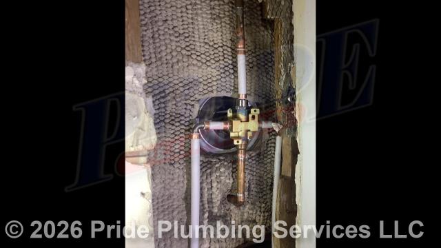Pride Plumbing came out and replaced a leaking single-handle bathtub/shower faucet valve with a new single-handle Delta model with chrome trim (shower head, faucet valve handle and cover, downspout diverter, and overflow and drain covers). This included cutting an access in the shower wall and replacing the valve along with short sections of its hot- and cold-water supply lines with new PEX piping and fittings.