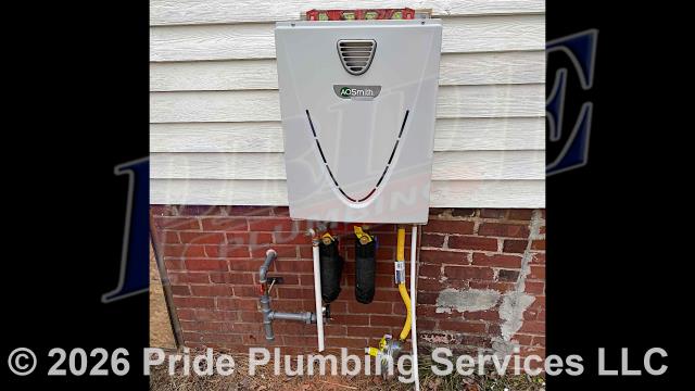 Pride Plumbing came out and installed a new A.O. Smith T-H3J-OS-N natural gas tankless water heater. This included: 1) installing the new tankless unit along with Jomar service valves, PEX and stainless steel water lines to the unit's water connections, black iron gas supply piping and fittings, gas regulator, and condensation and intake lines; 2) cutting, capping, and rerouting the home’s hot and cold water supply lines over to the location of the new water heater; 3) installing a new gas line over to the unit’s location along with a drip leg and gas shutoff valve; 4) wiring up the unit; 5) ensuring that it was properly vented; and 6) lighting and programming the unit.