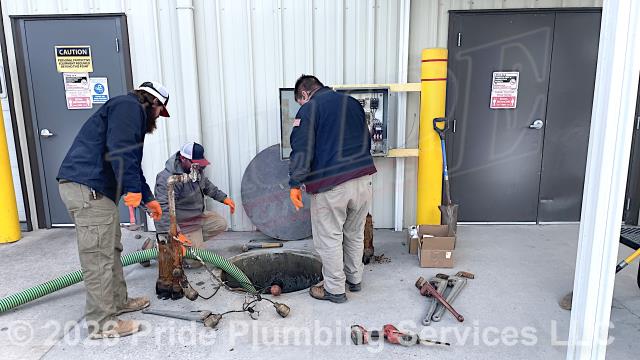 Pride Plumbing came out and, after pumping out their sewage basin, pulled two sewage grinder pumps and their float switches, replaced them with new Liberty LSG203M Omnivore models, installed new ball valve/check valve/union combos, connected the electrical wiring to their control box, and tested the pumps.