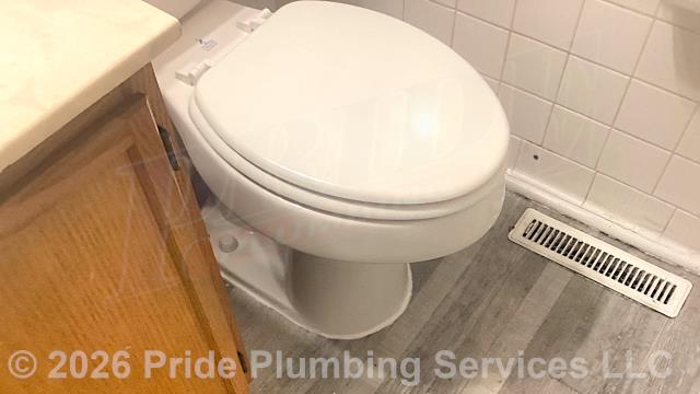 Pride Plumbing was called out for a Crane toilet bowl leaking at its base. We pulled the toilet, cleaned and inspected its flange, replaced its single wax ring gasket with two new Mainline ML11580 models, reset the toilet, replaced its toilet bowl bolts and caps and the toilet tank's above-floor braided stainless steel water supply line. We tested for leaks and proper operation with no issues and caulked around the base of the toilet bowl.