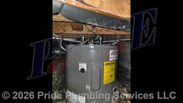 Pride Plumbing came out and replaced a leaking 38-gallon electric American Premiere Plus lowboy water heater with a new 38-gallon electric Rheem PROE38-S2-RH95-B lowboy model. This included removing and disposing of the old water heater; installing the new water heater, ball water shut-off valves, PEX and stainless steel water supply lines to the water heater connectors, a brass drain valve, bleeding the air out of the water lines, ensuring that the unit’s temperature and pressure (T&P) relief valve was properly vented, wiring the water heater's electrical connections (adding a Romex connector), and setting the unit to its appropriate operating temperature.