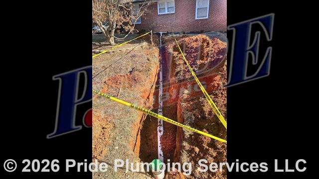 Pride Plumbing came out and 1) used an excavator to trench a ditch from the house to the town sewer tap to expose and remove the outside main sewer septic drain line; 2) installed a new 4-inch PVC sewer drain line (connecting it to the town's sewer tap at the edge of the property and the main drain line underneath the home) along with proper cleanouts and fittings per code; 3) installed tracer wire in the ditch along with the new sewer drain line; and 4) backfilled, tamped, and spread grass seed and straw after the work was inspected and approved by Stanly County's Inspection Department.