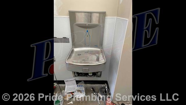 Pride Plumbing came out and performed the following work: 1) installed a new Kohler pressure-assisted toilet along with new wax seal, bolts, and supply line and two new American Standard wall-hung lavatories with Delta faucets and trap wraps; 2) installed a new Murdock bi-level water cooler with a bottle filler; 3) at a pet wash station, installed a JR Smith floor cleanout, hub drain with trap seal, two Zurn floor sinks, a pet wash sink, an ADA pet wash sink, a Navien LP gas tankless water heater (along with an isolation valve kit and a concentric vent kit), and a Liberty sewage pump; 4) reinstalled a breakroom sink; 5) installed a new gas line along with a ball valve, drip leg, and gas regulator; 6) removed a section of concrete and installed underground plumbing and a lift station; and 7) jet-washed the building's main drain line in the bathroom and pet wash station and used a sewer camera to determine its condition.