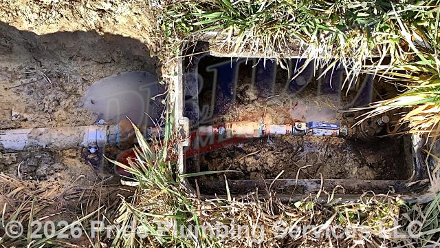 Pride Plumbing was called out for a water leak in the yard. The customer had already shut the water off and dug down and uncovered the area which allowed us to see that the leak was near the water meter on a black roll main outside water supply line. We removed a ball valve and check valve and used PEX piping and fittings to reconnect them to the existing black roll supply line. We then turned the water back on and flushed debris out of the water line at an outside hose bib spigot. Finally, we checked for leaks and there weren't any.