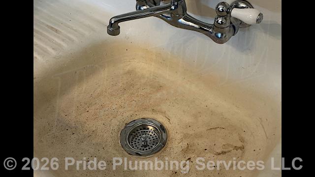 Pride Plumbing was called out for a water leak underneath an outside utility sink. Our inspection found that the sink's basket strainer was leaking. We removed and replaced the basket strainer (with a new Kohler model), P-trap, and flange tailpiece, tested for leaks, and the issue was corrected.
