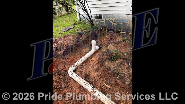 Pride Plumbing came out and 1) used an excavator to trench a ditch from the house to the town sewer tap to expose and remove the outside main sewer septic drain line; 2) installed a new 4-inch PVC sewer drain line (connecting it to the town's sewer tap at the edge of the property and the main drain line underneath the home) along with proper cleanouts and fittings per code; 3) installed tracer wire in the ditch along with the new sewer drain line; and 4) backfilled, tamped, and spread grass seed and straw after the work was inspected and approved by Anson County's Inspection Department.