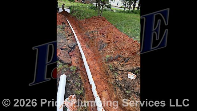 Pride Plumbing came out and 1) used an excavator to trench a ditch from the house to the town sewer tap to expose and remove the outside main sewer septic drain line; 2) installed a new 4-inch PVC sewer drain line (connecting it to the town's sewer tap at the edge of the property and the main drain line underneath the home) along with proper cleanouts and fittings per code; 3) installed tracer wire in the ditch along with the new sewer drain line; and 4) backfilled, tamped, and spread grass seed and straw after the work was inspected and approved by Anson County's Inspection Department.