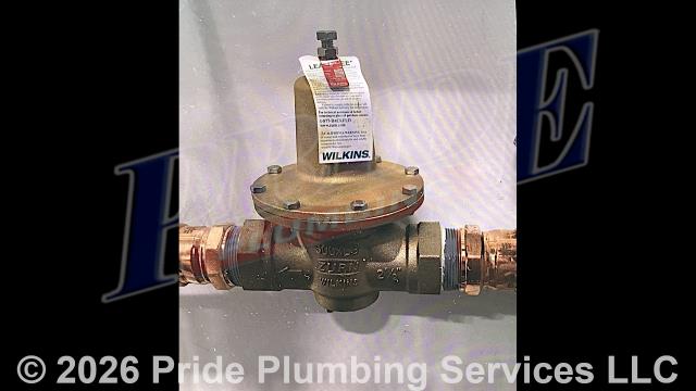 Pride Plumbing came out and performed the following work: 1) shut off the water to the building and drained the water lines; 2) cut out and replaced a 2 1/2-inch pressure reducing valve (PRV) on the copper main water line by ProPressing in a new Zurn Wilkins valve; 3) installed a pressure gauge on the water line above the PRV; 4) turned the water back on and tested for leaks; 5) went through the building and bled air from the water lines and tested all the plumbing fixtures; and 6) adjusted the pressure on the PRV to 45 psi and there were no further issues.