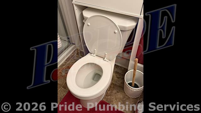 Pride Plumbing came out and replaced a toilet with a new Gerber Viper round-front model. This included draining and pulling the old toilet, inspecting and cleaning the flange, replacing the toilet bowl, toilet tank, tank to bowl gasket and bolts, seat, wax ring gasket, toilet bowl bolts, toilet bowl bolt washers, toilet bowl bolt caps, and above-floor braided stainless-steel water supply line. Once installed, we tested for leaks and proper operation with no issues. We also replaced a kitchen sink's under-sink drain assembly, P-trap, and drain line through the floor to under the house in the crawlspace, and to where it ties into the main sewer drain stack, with new PVC piping and fittings (adding three 1/16-inch bends and a Santee). Also, underneath the sink, we added an air admittance valve on the drain assembly.