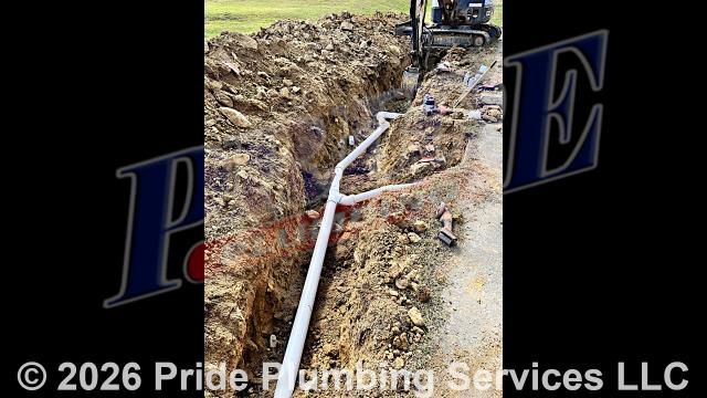 Pride Plumbing successfully completed a comprehensive demolition and excavation project. We meticulously removed most of the concrete, leaving only a small section to be cut. The long concrete run was broken but required disposal, which we managed using a dump truck and a skid steer. After cutting and breaking the remaining concrete, we piled it on site. We then made the ditch line areas accessible for drain line excavation. In the splash pad area, we discovered a cast line entering 4” clay. We removed the clay pipe and added 22 and 45 elbows to redirect it. We continued running 4” PVC alongside the concrete area, encountering significant rock but successfully making multiple connections to the existing drain lines.