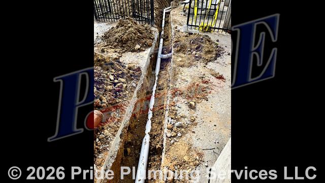 Pride Plumbing successfully completed a comprehensive demolition and excavation project. We meticulously removed most of the concrete, leaving only a small section to be cut. The long concrete run was broken but required disposal, which we managed using a dump truck and a skid steer. After cutting and breaking the remaining concrete, we piled it on site. We then made the ditch line areas accessible for drain line excavation. In the splash pad area, we discovered a cast line entering 4” clay. We removed the clay pipe and added 22 and 45 elbows to redirect it. We continued running 4” PVC alongside the concrete area, encountering significant rock but successfully making multiple connections to the existing drain lines.