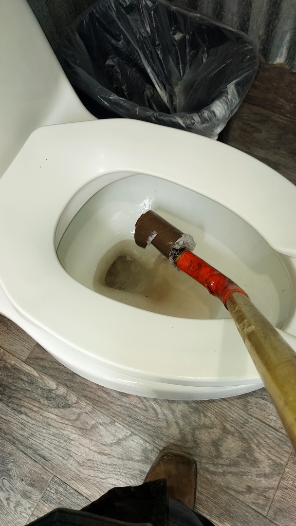 Women's toilet backed up remove toilet paper roll with auger Women's toilet backed up remove toilet paper roll with auger