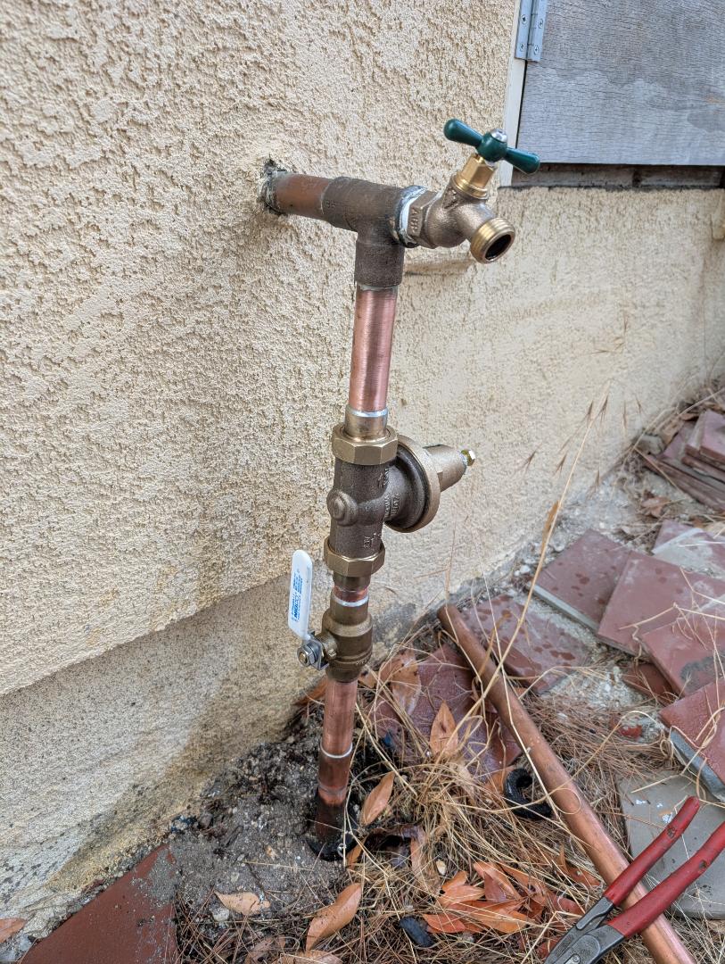 rebuilt a water service entrance with a new pressure regulator, ball valve shut off and hose bibb in Paso Robles.