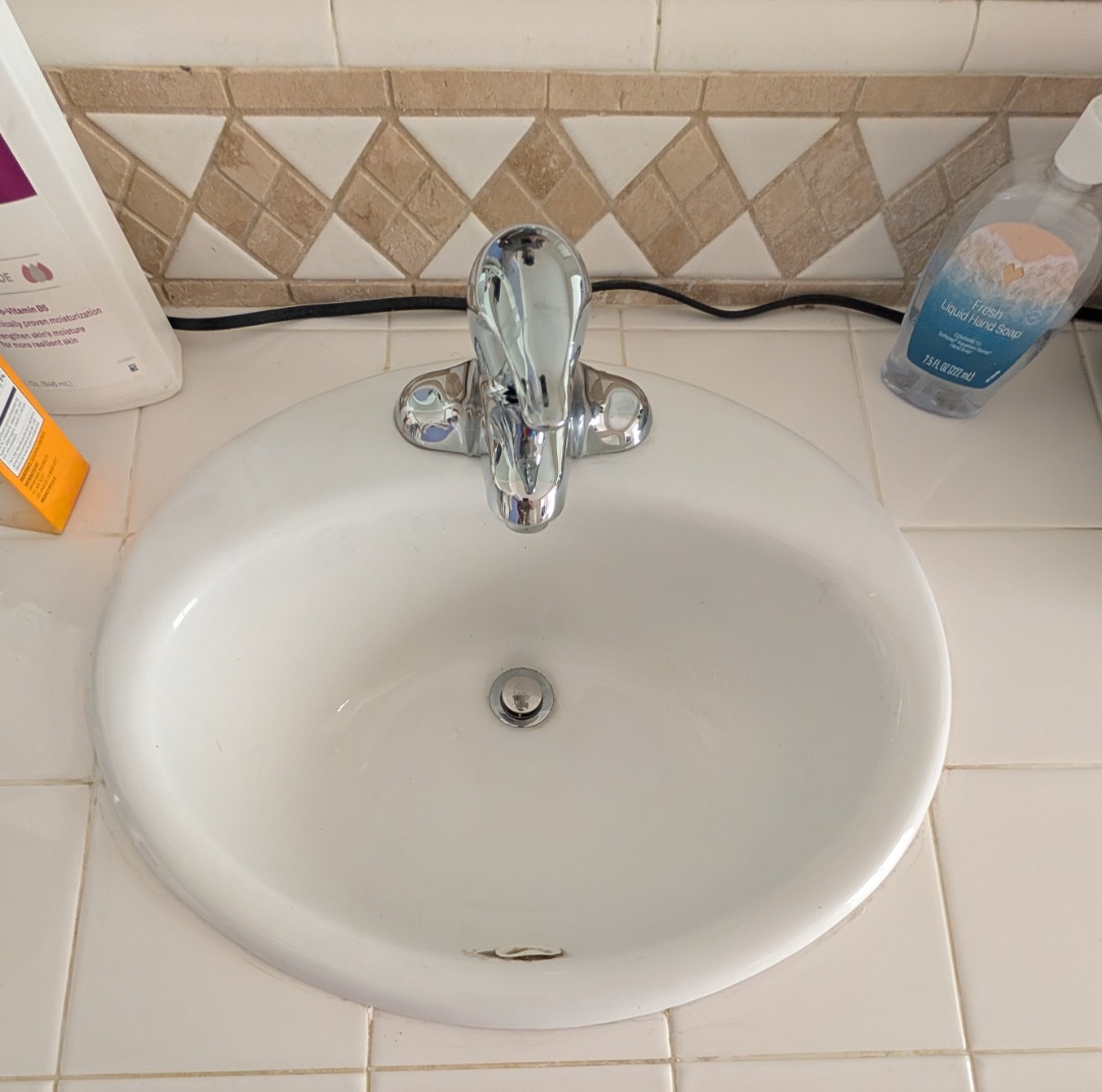 Replaced a Price Pfister bathroom lav faucet with a new Moen Chateau lavatory faucet in Atascadero.  