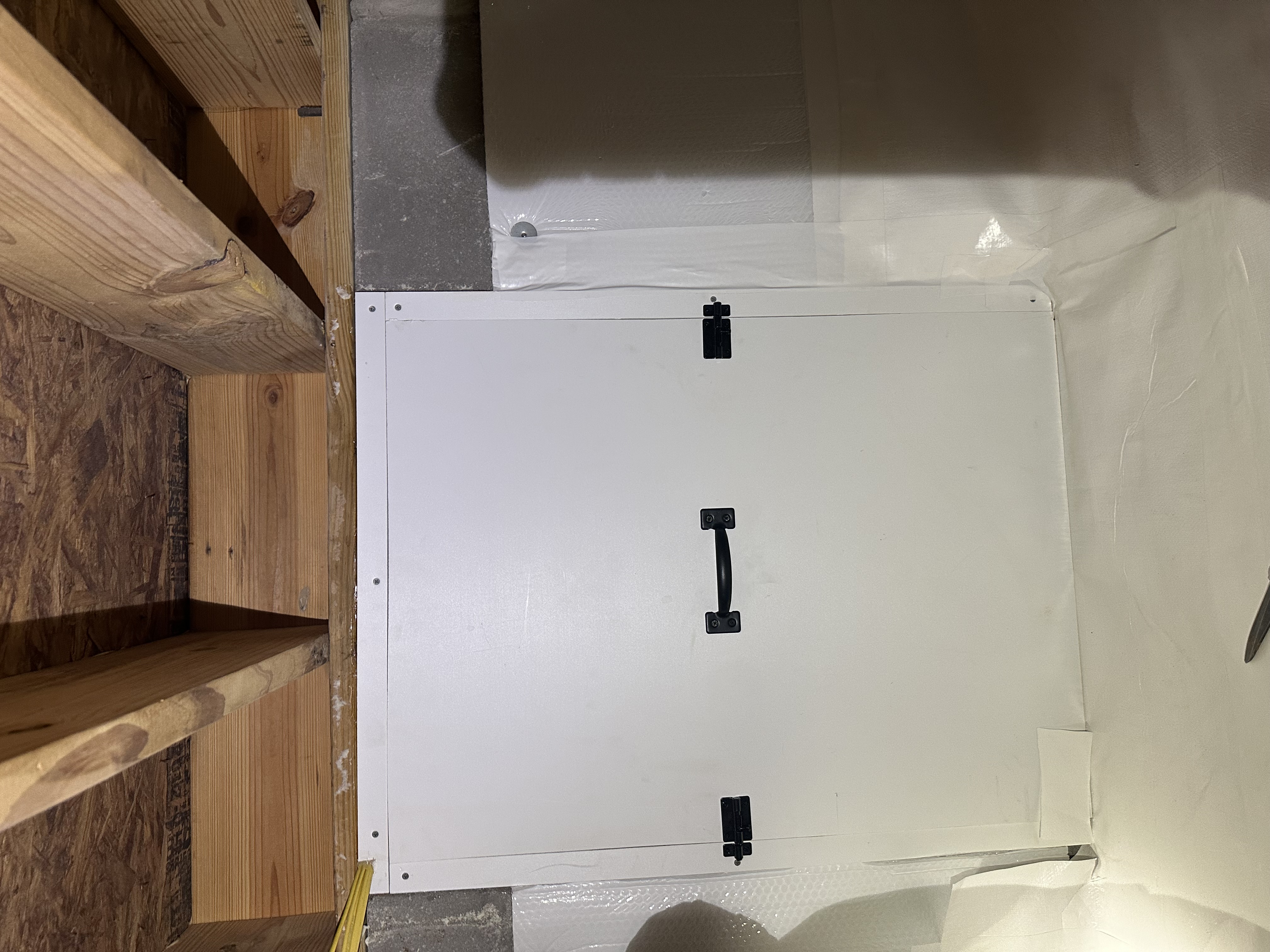 I constructed a custom access door in the crawlspace, ensuring it was airtight to prevent humidity. This improved ventilation and accessibility for the customer.
