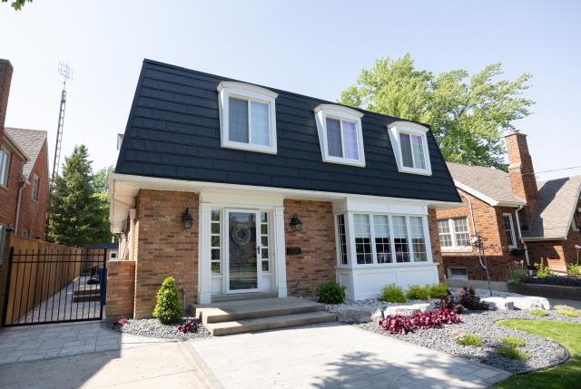 For this Chatham project, the homeowner wanted a refined, timeless look that would elevate their home’s character while providing long-term reliability. The unique mansard-style roof added complexity, requiring a product that could handle steep pitches and intricate detailing.

We installed Country Towne’s metal slate shingles, which delivered the classic beauty of slate with the strength and low-maintenance benefits of steel. Each shingle was carefully aligned to complement the mansard profile, creating a crisp, elegant finish that perfectly frames the home’s architecture.

The result is a striking roof that boosts curb appeal and provides dependable protection for years to come—proof that metal slate shingles are an ideal choice for even the most challenging roof styles.