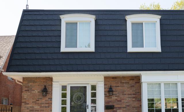 For this Chatham project, the homeowner wanted a refined, timeless look that would elevate their home’s character while providing long-term reliability. The unique mansard-style roof added complexity, requiring a product that could handle steep pitches and intricate detailing.

We installed Country Towne’s metal slate shingles, which delivered the classic beauty of slate with the strength and low-maintenance benefits of steel. Each shingle was carefully aligned to complement the mansard profile, creating a crisp, elegant finish that perfectly frames the home’s architecture.

The result is a striking roof that boosts curb appeal and provides dependable protection for years to come—proof that metal slate shingles are an ideal choice for even the most challenging roof styles.